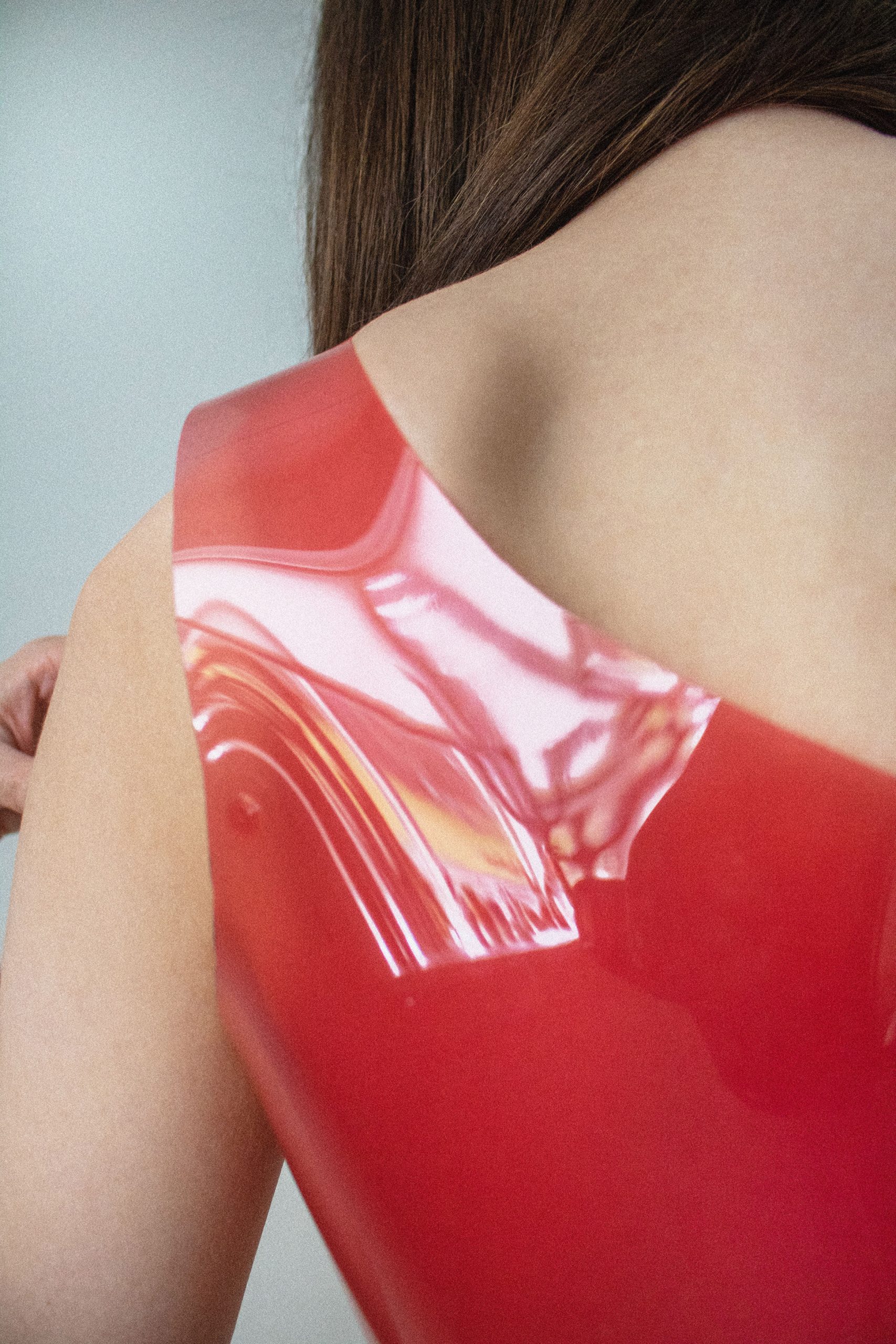 Close-up of woman wearing shiny red vest top by Valdís Steinarsdóttir