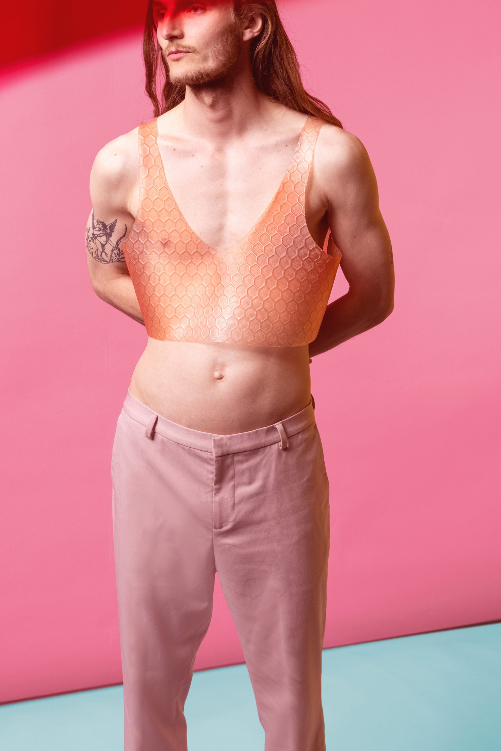 Person wearing textured flesh-coloured top from Shape.Repeat collection