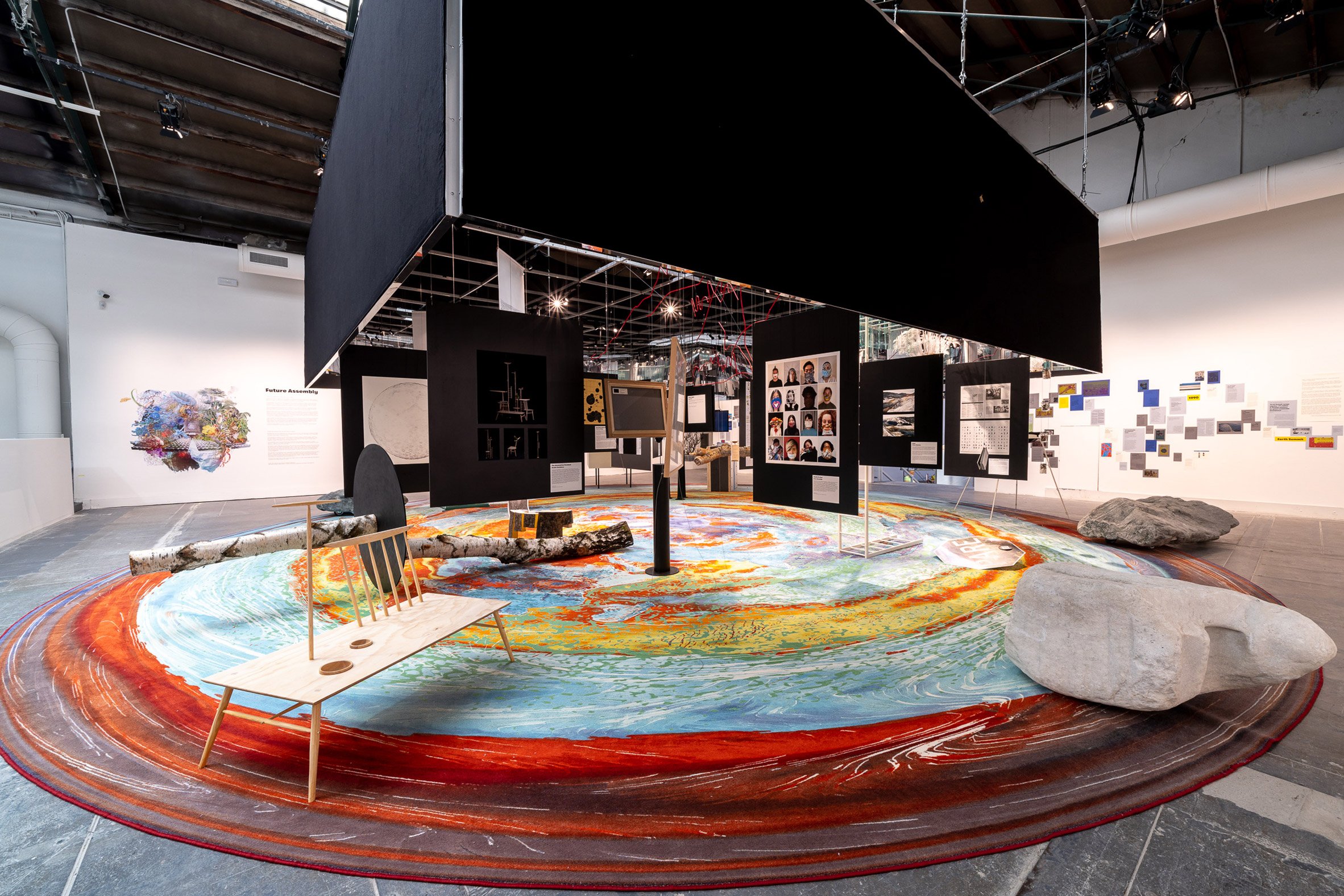 A circular rug covers the floor of the Future Assembly installation