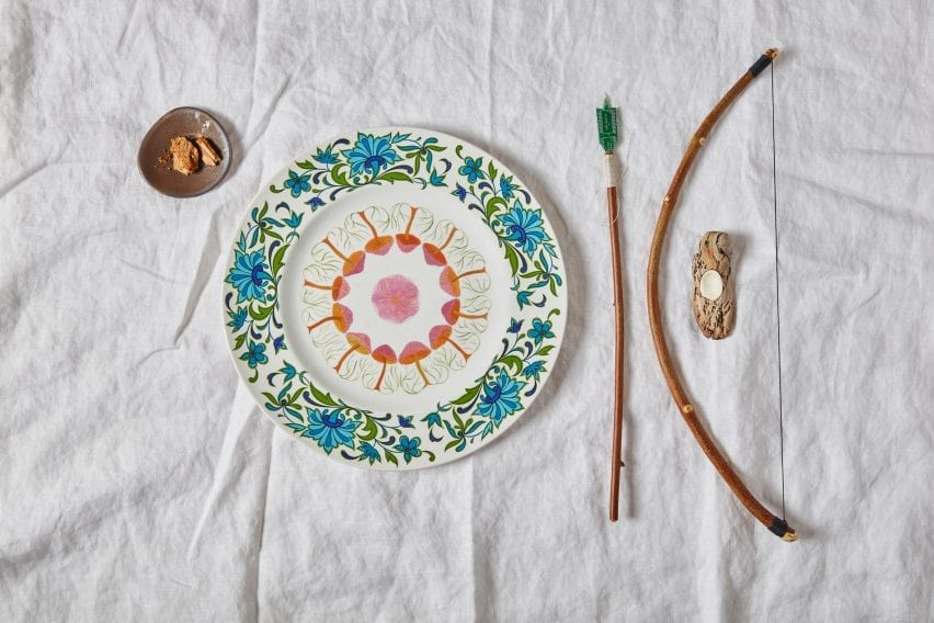 Close up of bespoke cutlery and colourful painted tableware from Refuge for Resurgence project