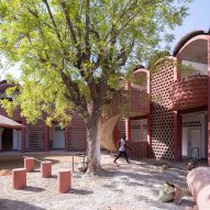 Manuel Herz encloses curvilinear hospital in Senegal with lattice brickwork