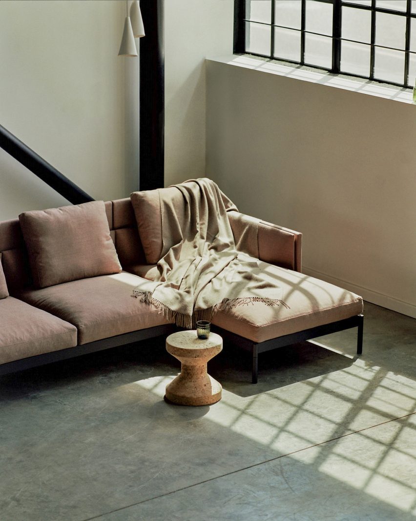 A dusky pink sofa with a chaise longue by Part & Whole