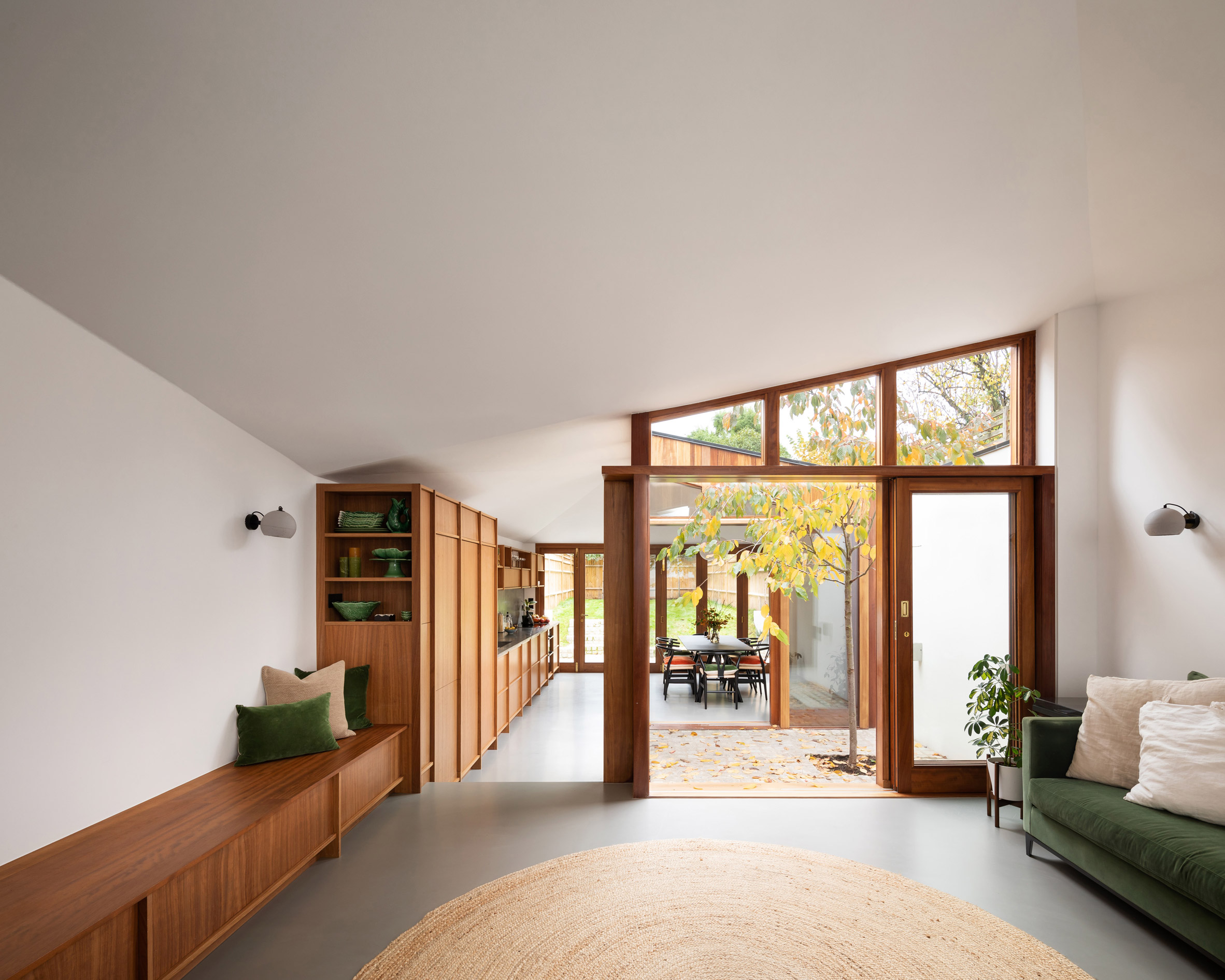 A living room punctured by a courtyard