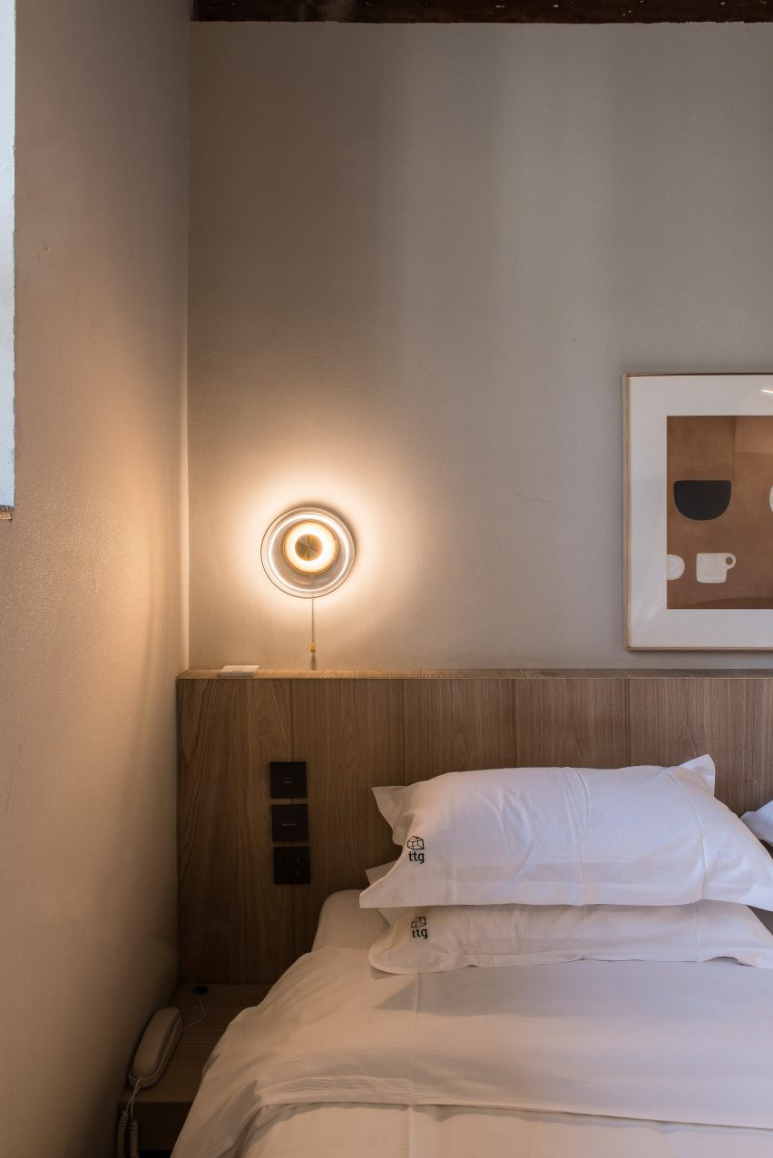 Guest bedroom in renovated hutong hotel by Fon Studio