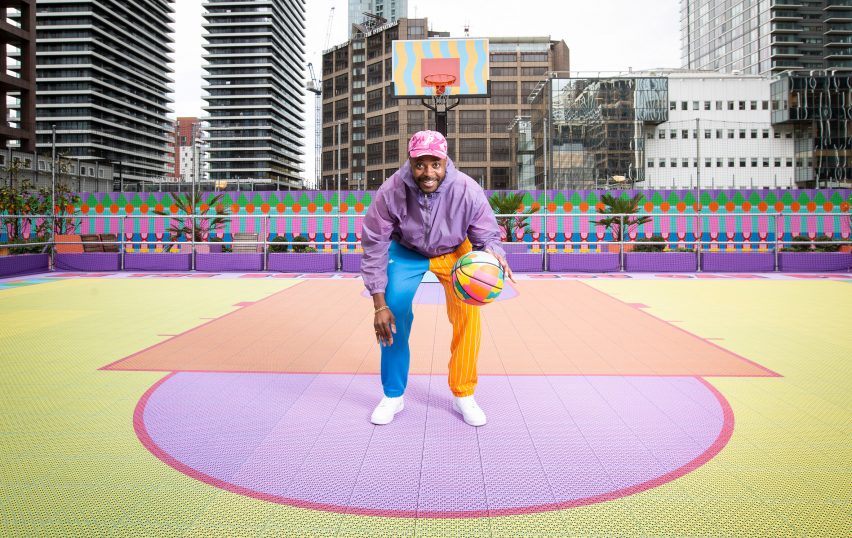 Yinka Ilori dribbling on colourful basketball court