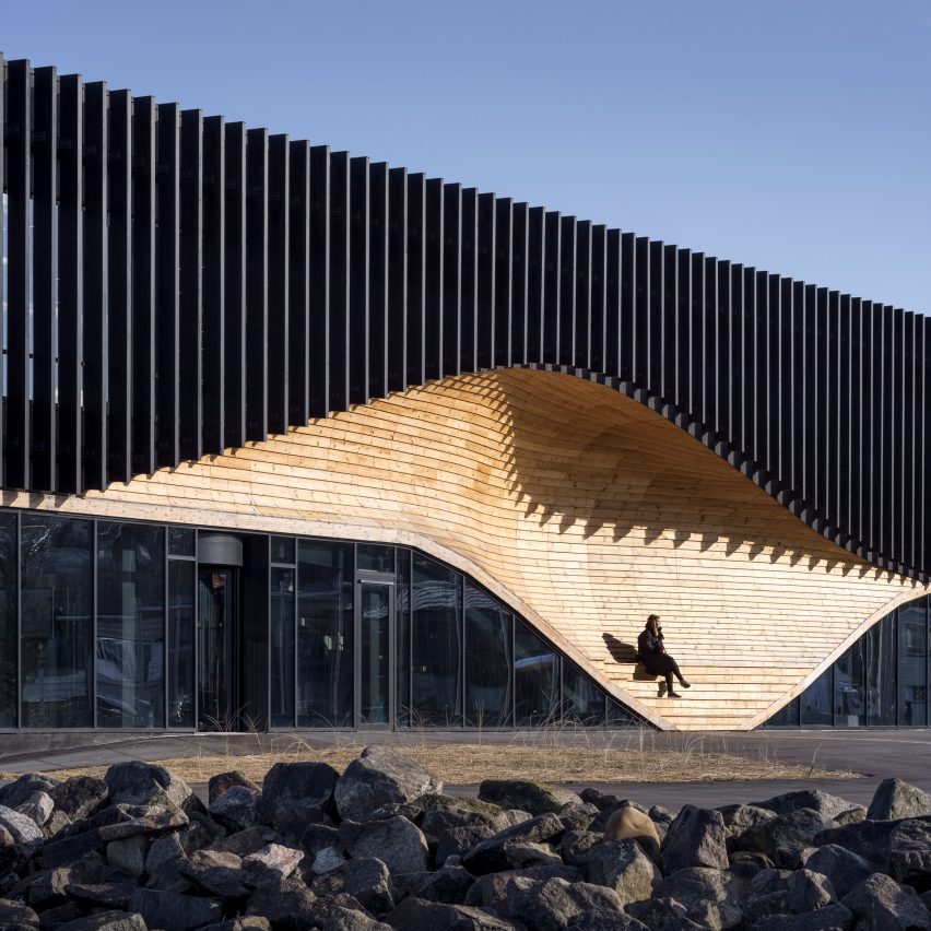 A wooden facade with integrated seating