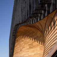 An undulating wooden facade