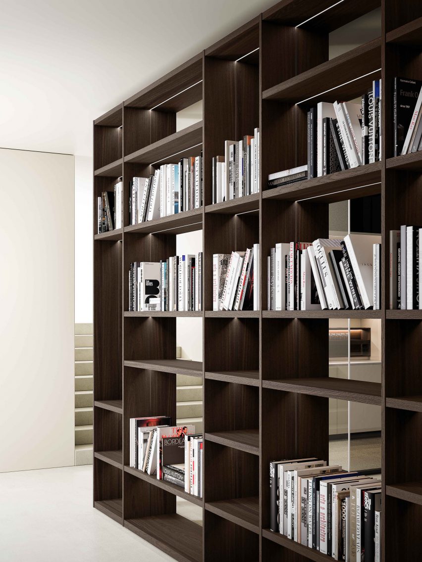 Wooden shelving system by Boffi holding books