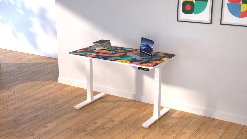 White standing desk with print by Happyminders