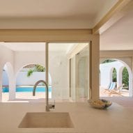 Arched openings connect indoor and outdoor spaces in 1960s Spanish holiday home