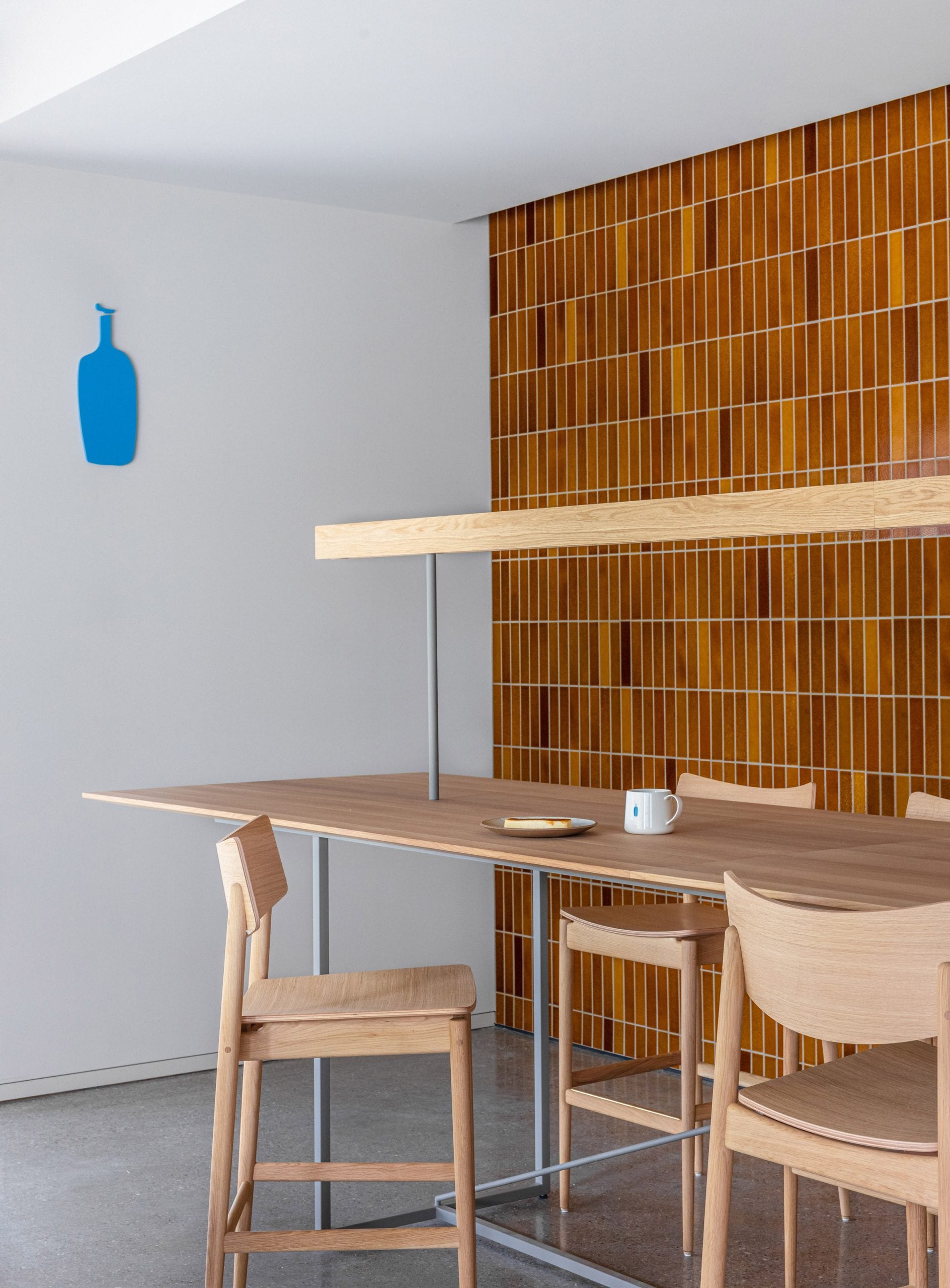 Brow-tiled walls and wooden counter seating in Blue Bottle Coffee Shibuya