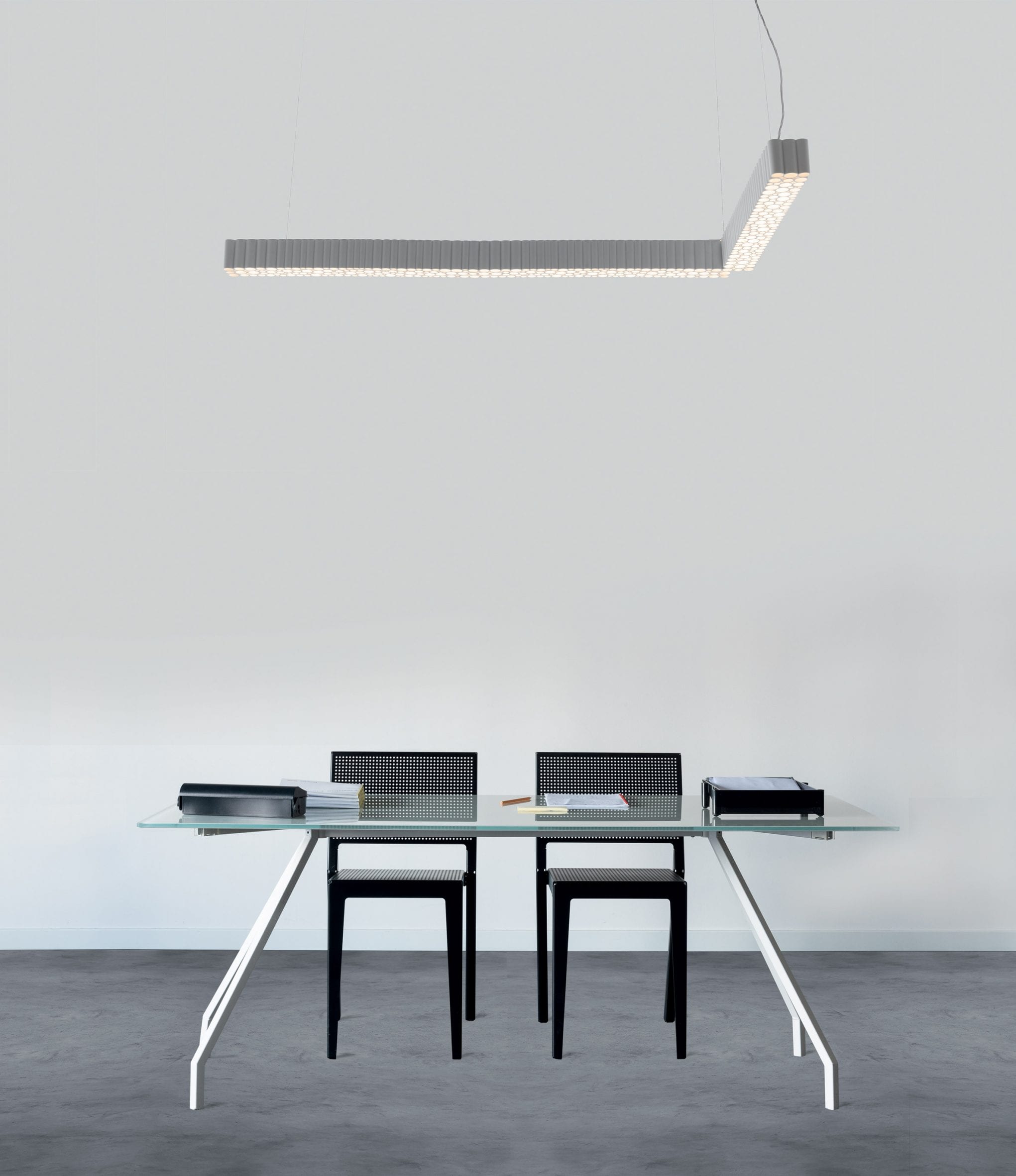 A Calipso light hanging above an office desk
