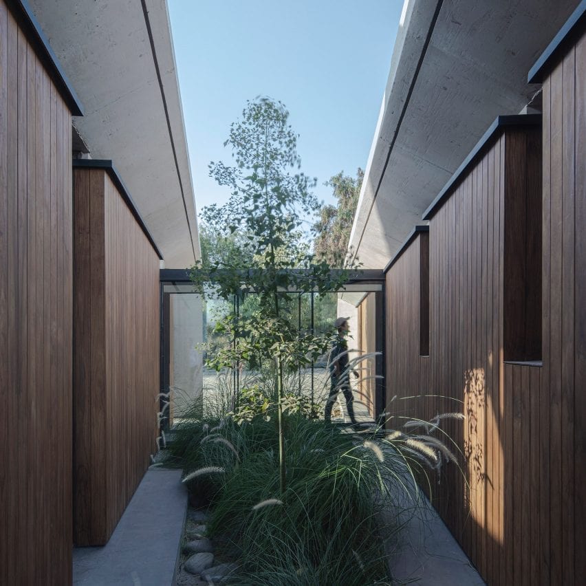 Courtyard between two volumes of concrete house in Chile