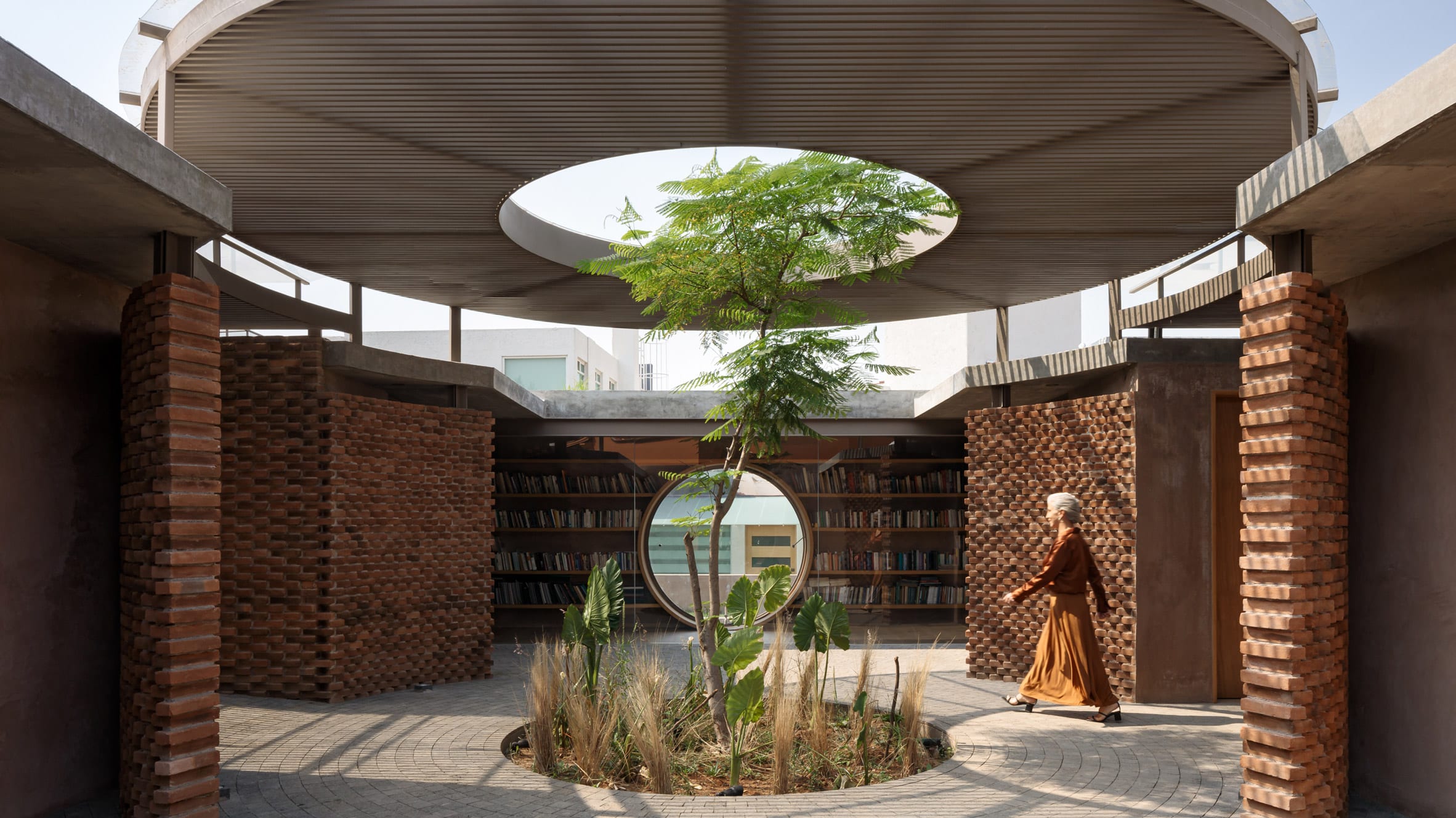 Tree grows through courtyard of Casa UC by Daniela Bucio Sistos