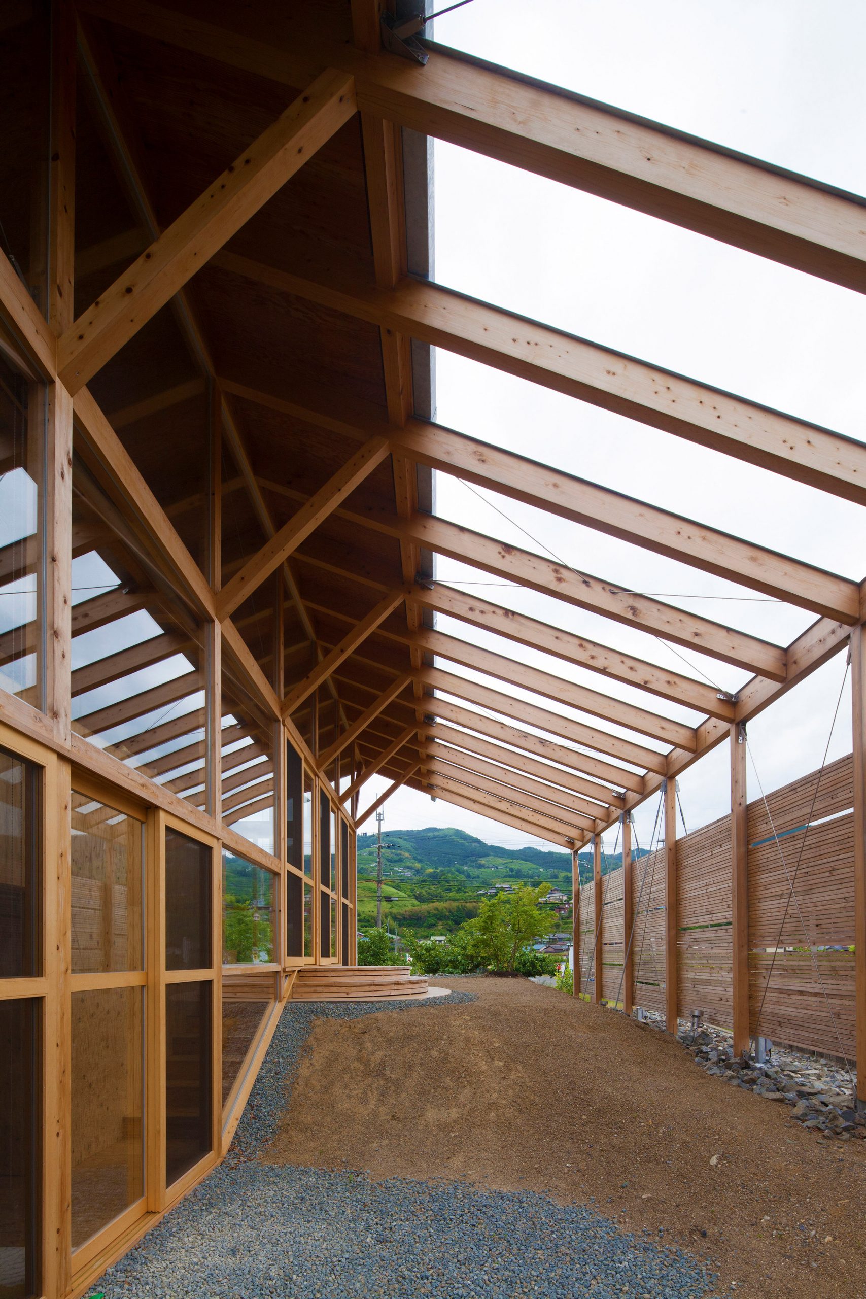 Half Barn in Hashimoto timber frame with wall of glazing