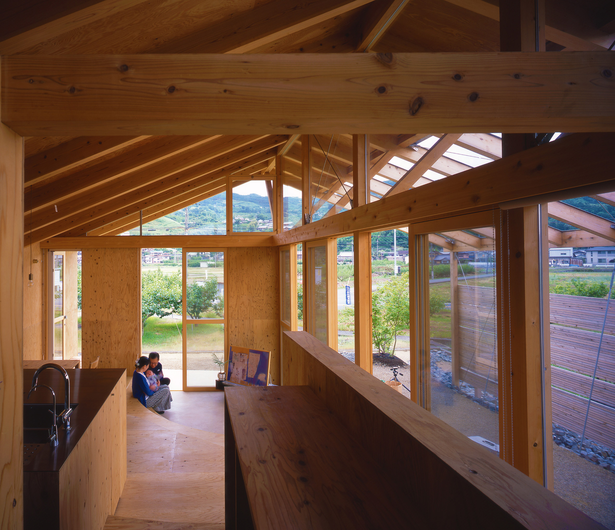 Barn-like timber home interior connected to the outdoors
