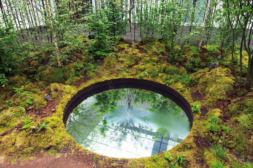 Invocation for Hope in Vienna features a circular reflection pool surrounded by moss