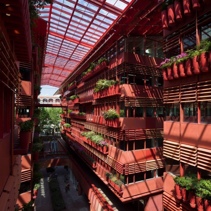 The building has red internal facades