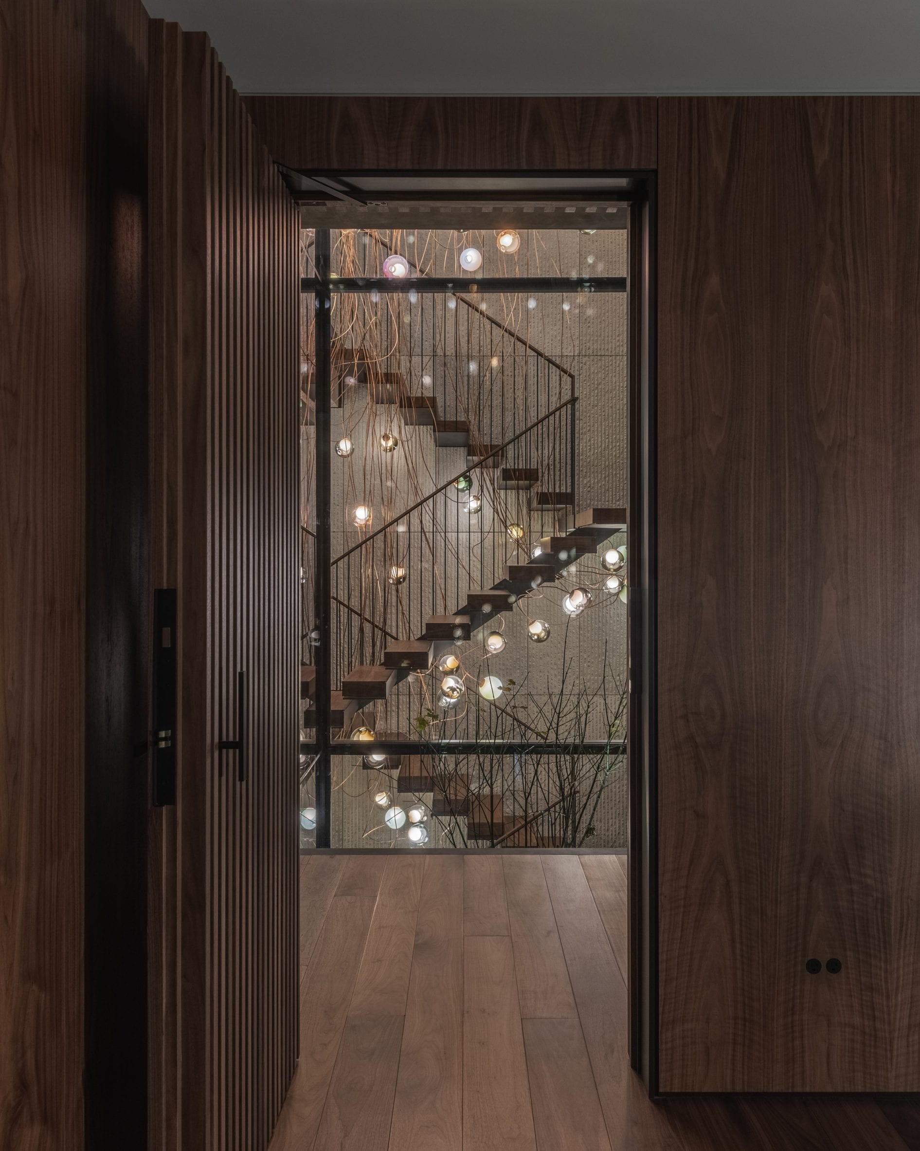 A lighting installation floats in the stairwell