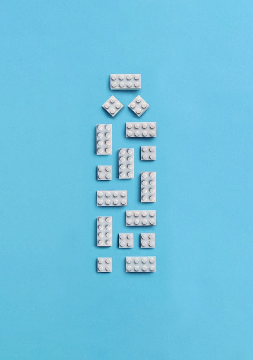 White lego bricks arranged in the shape of a bottle