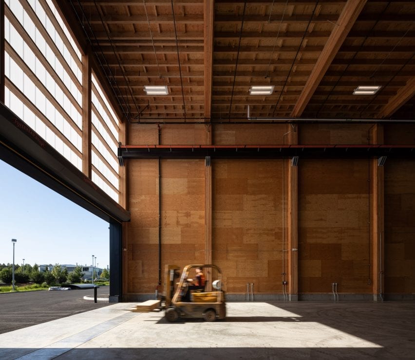 Inside, the building has expansive areas for developing and testing wood products