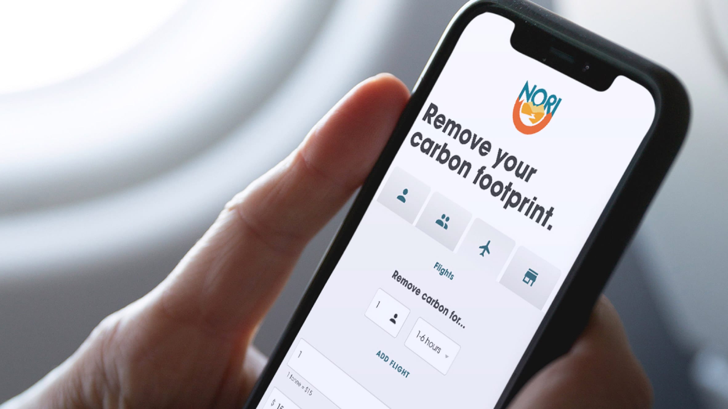Person using Nori carbon removal marketplace on their phone