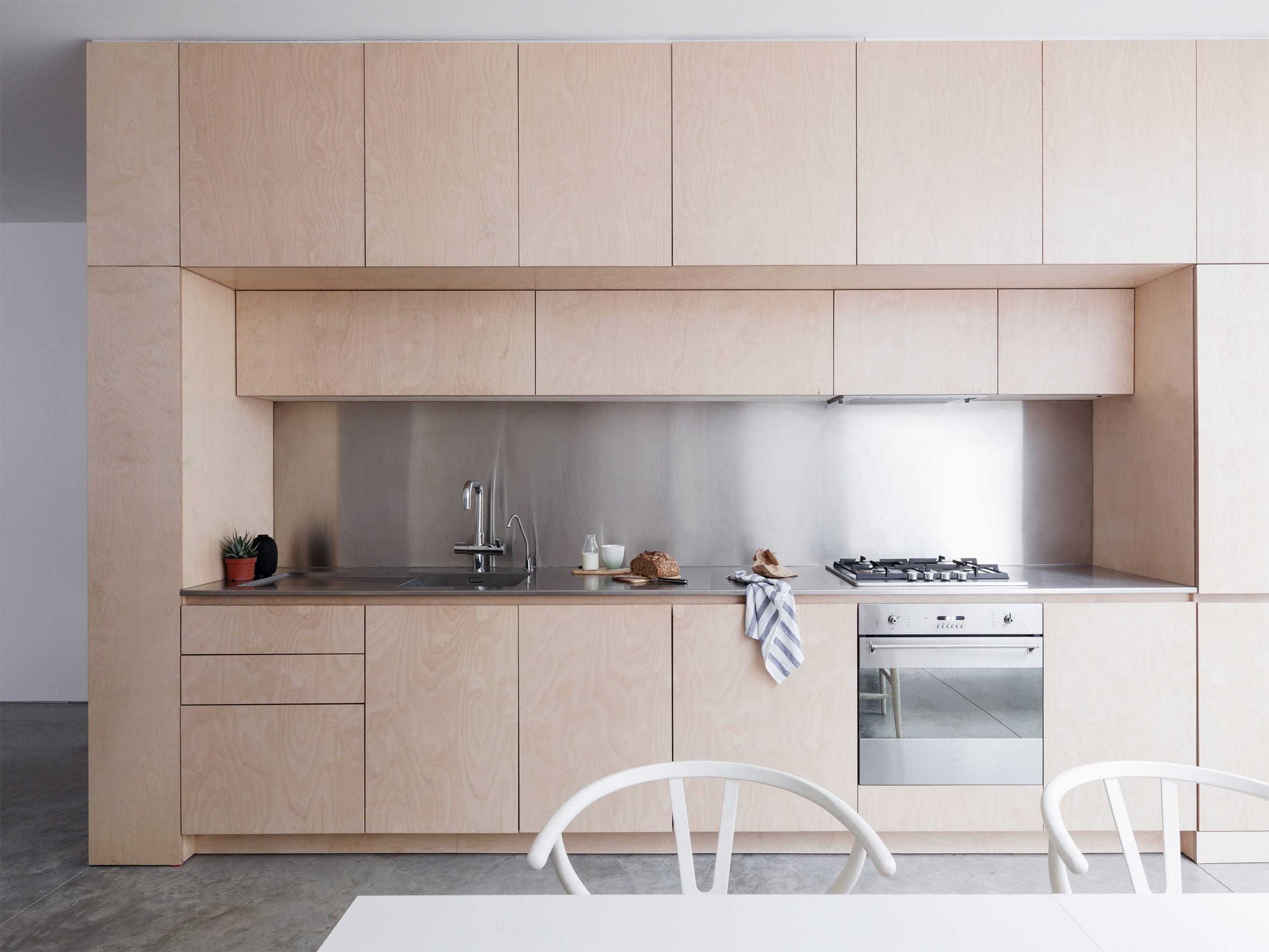Larissa Johnston built the one-wall kitchen within a plywood unit