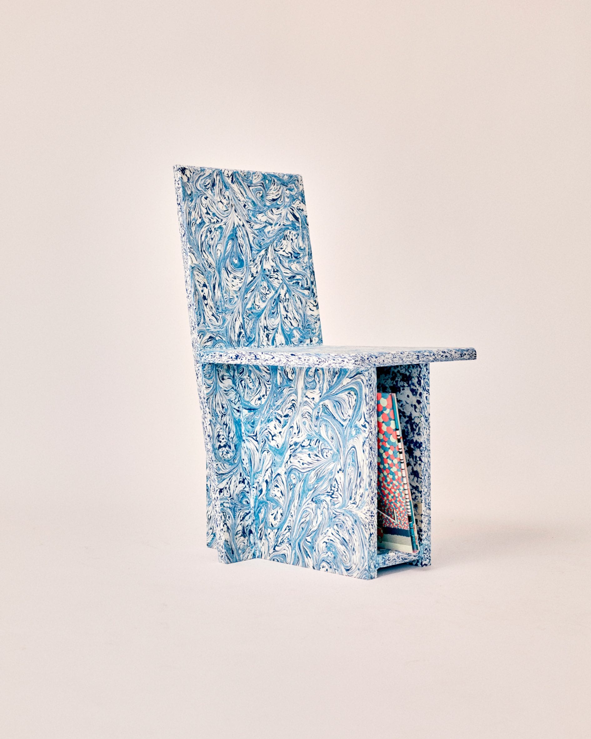Trash to Chair made from recycled plastic with swirly blue pattern and vinyl storage