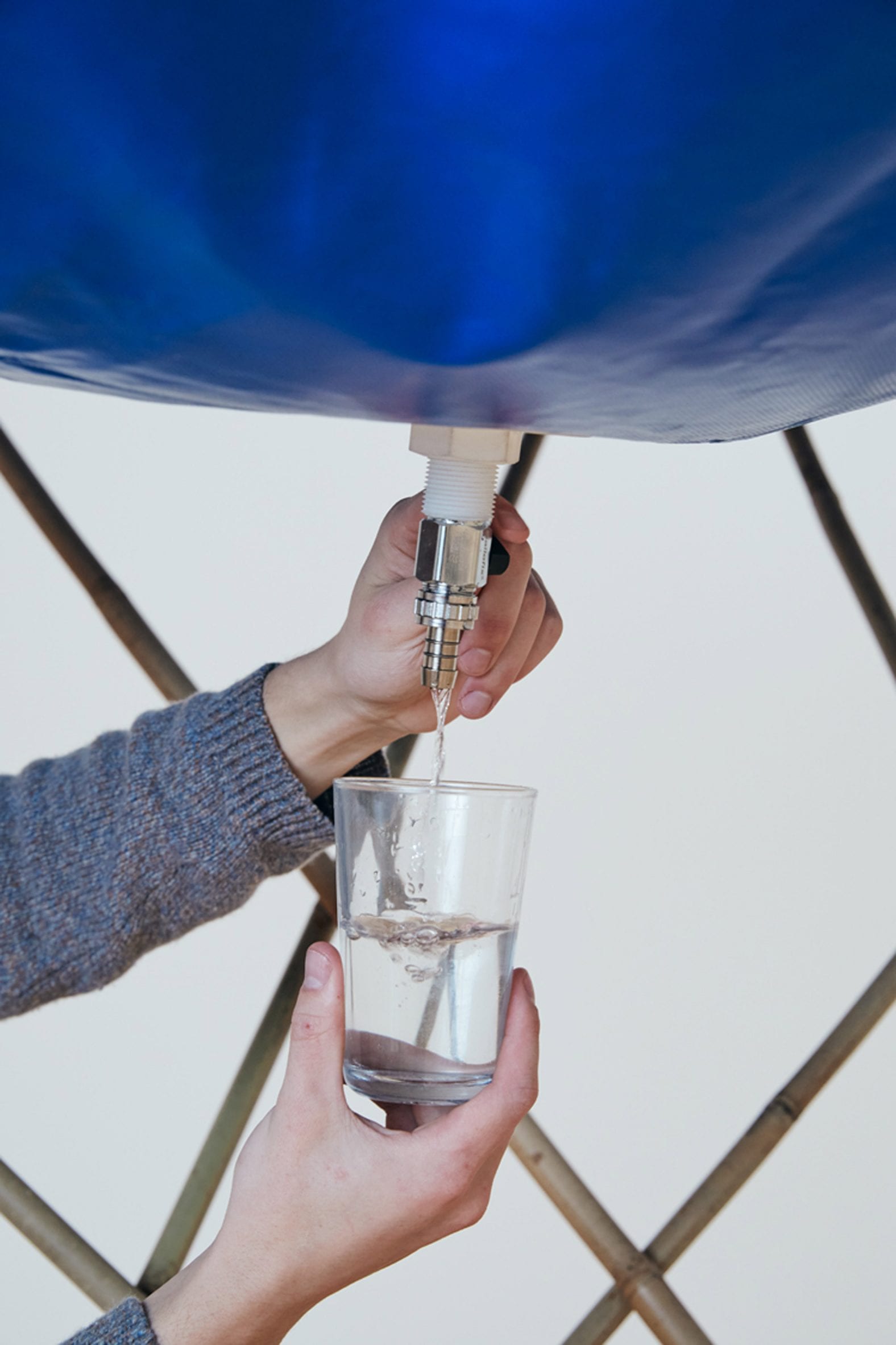 Water tap on portable solar distiller