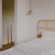 A wooden headboard frames the bed