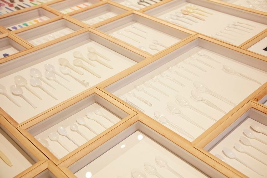 White spoons are displayed at exhibition
