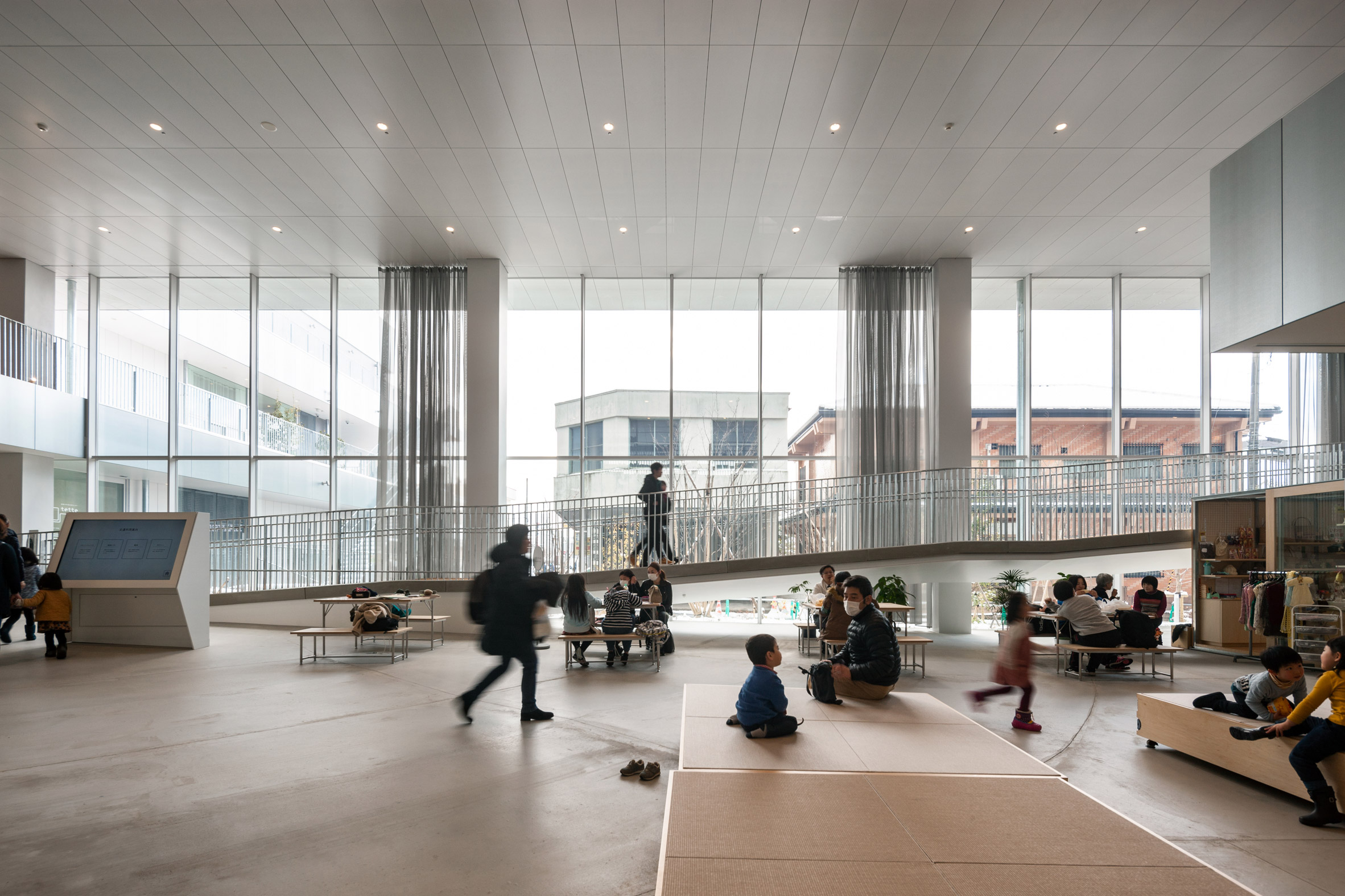 Floor-to-ceiling windows line the ground floor of The Sukagawa Community Center