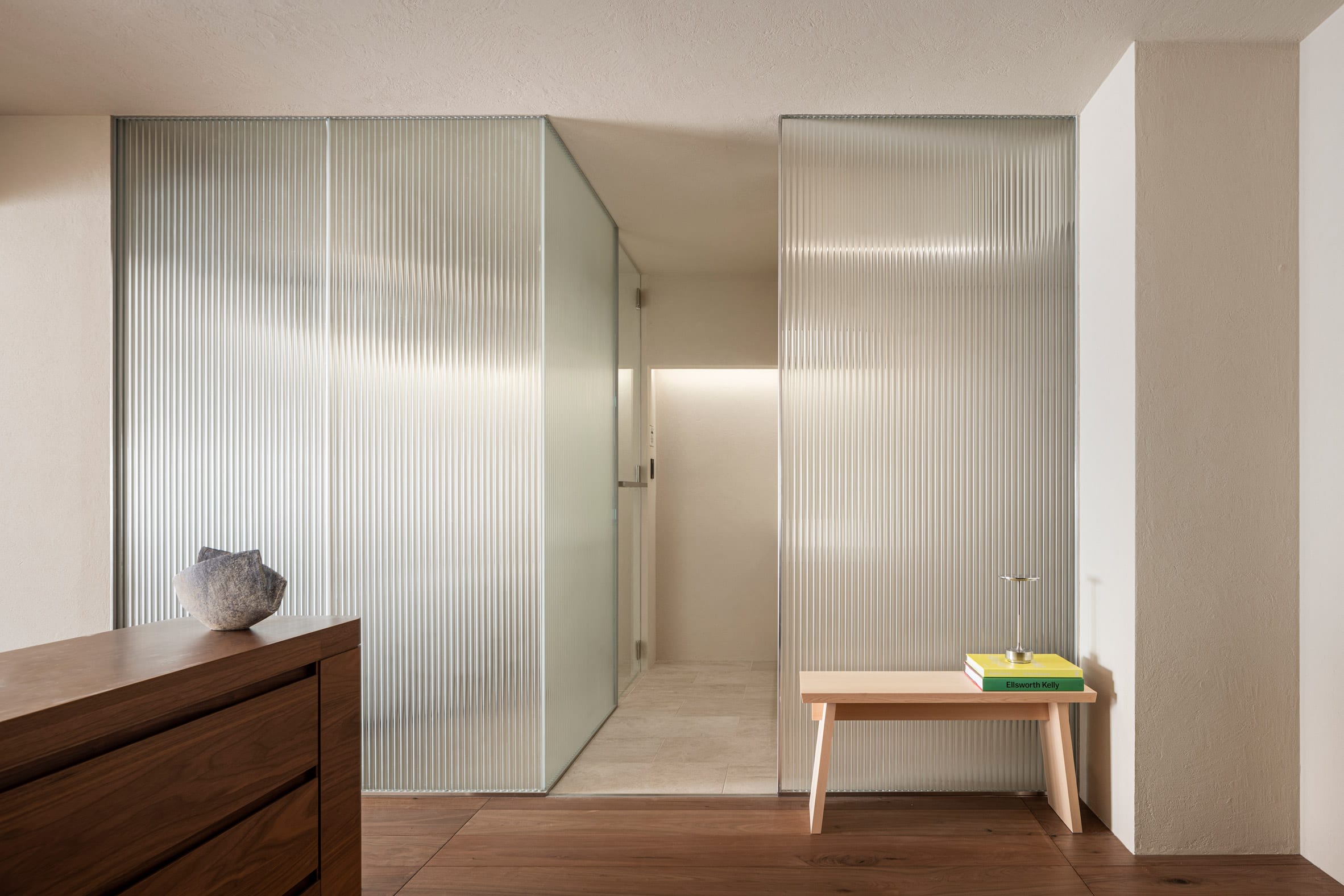 Reeded glass partitions and wood cupboard in The Life concept apartment