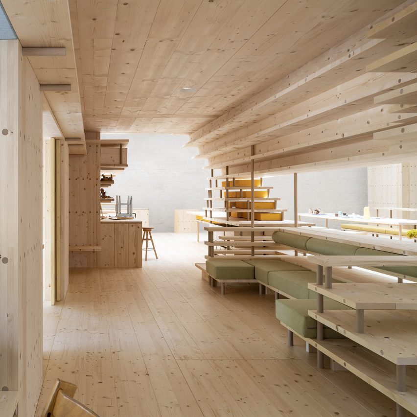 Wood lines the interior of a co-living space at the Nordic Pavilion