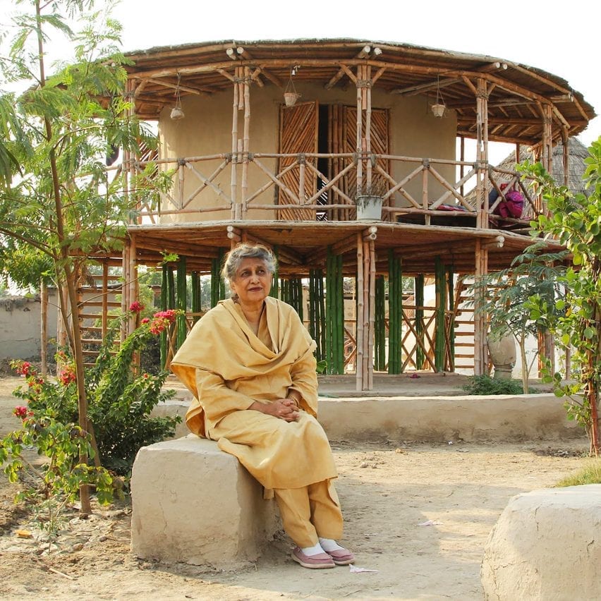 Yasmeen Lari in front of an earth and bamboo Women's Centre