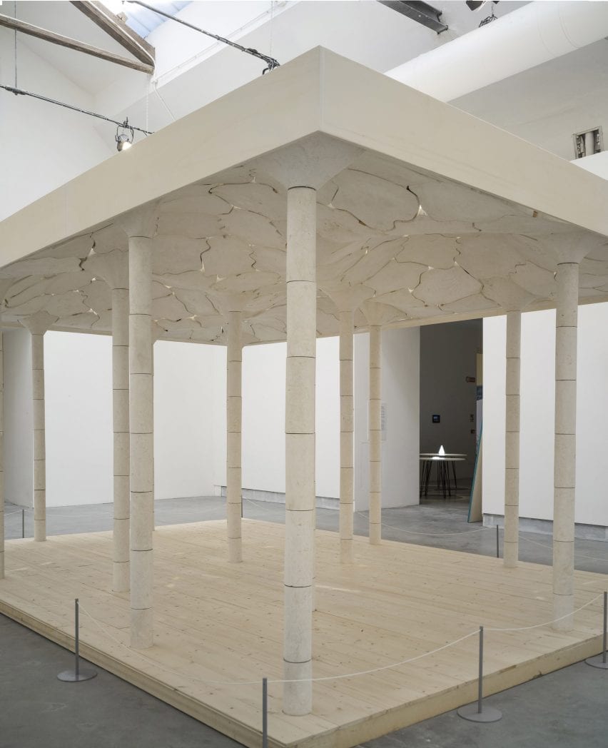 White limestone structure within a gallery
