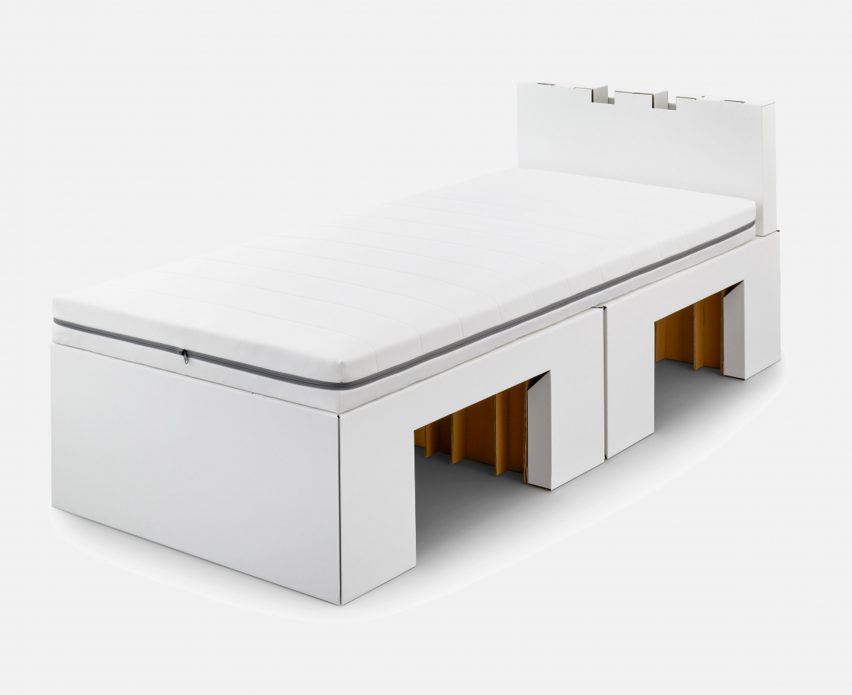 A white cardboard bed and mattress by Airweave