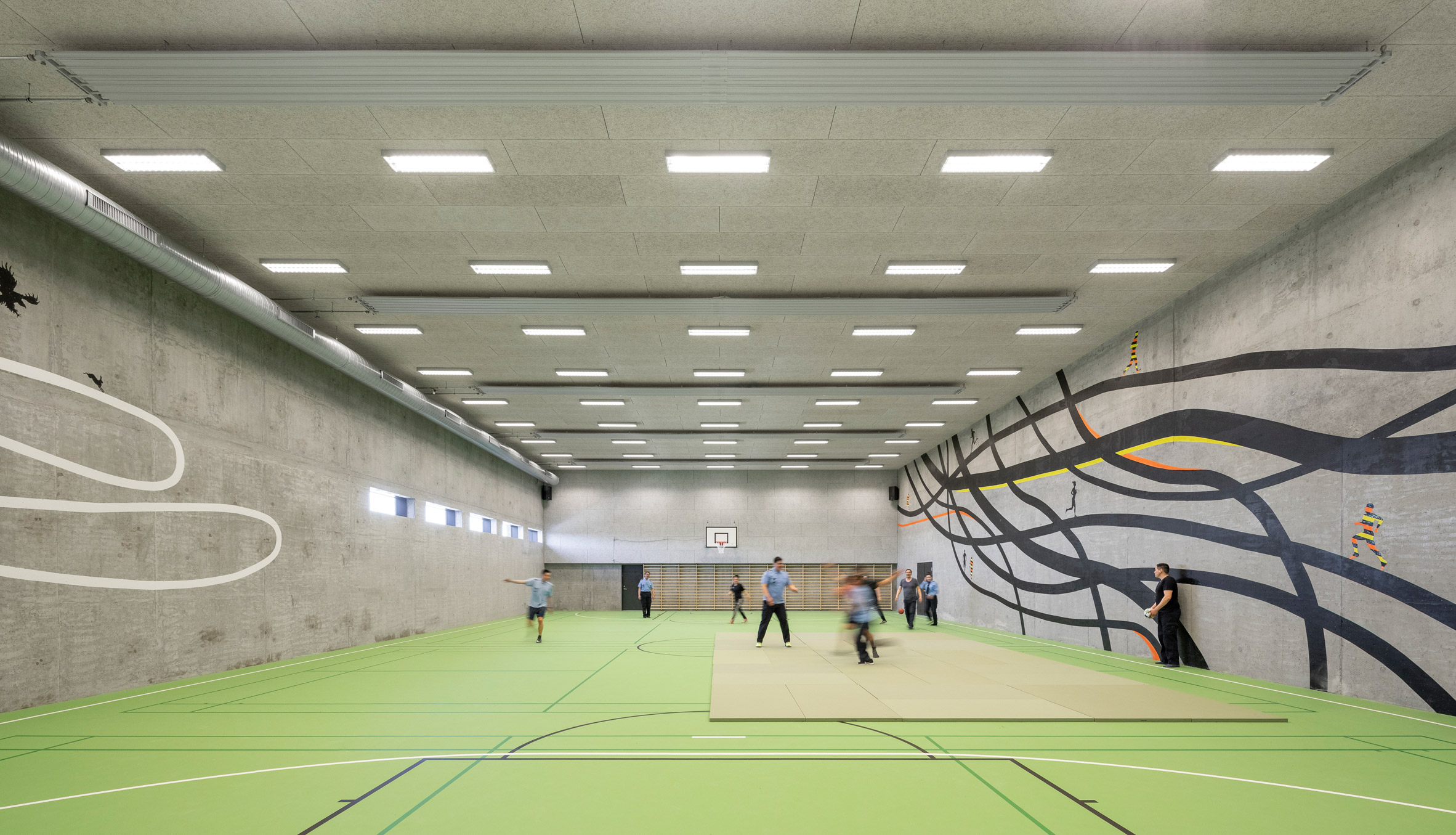 A sports hall with concrete walls