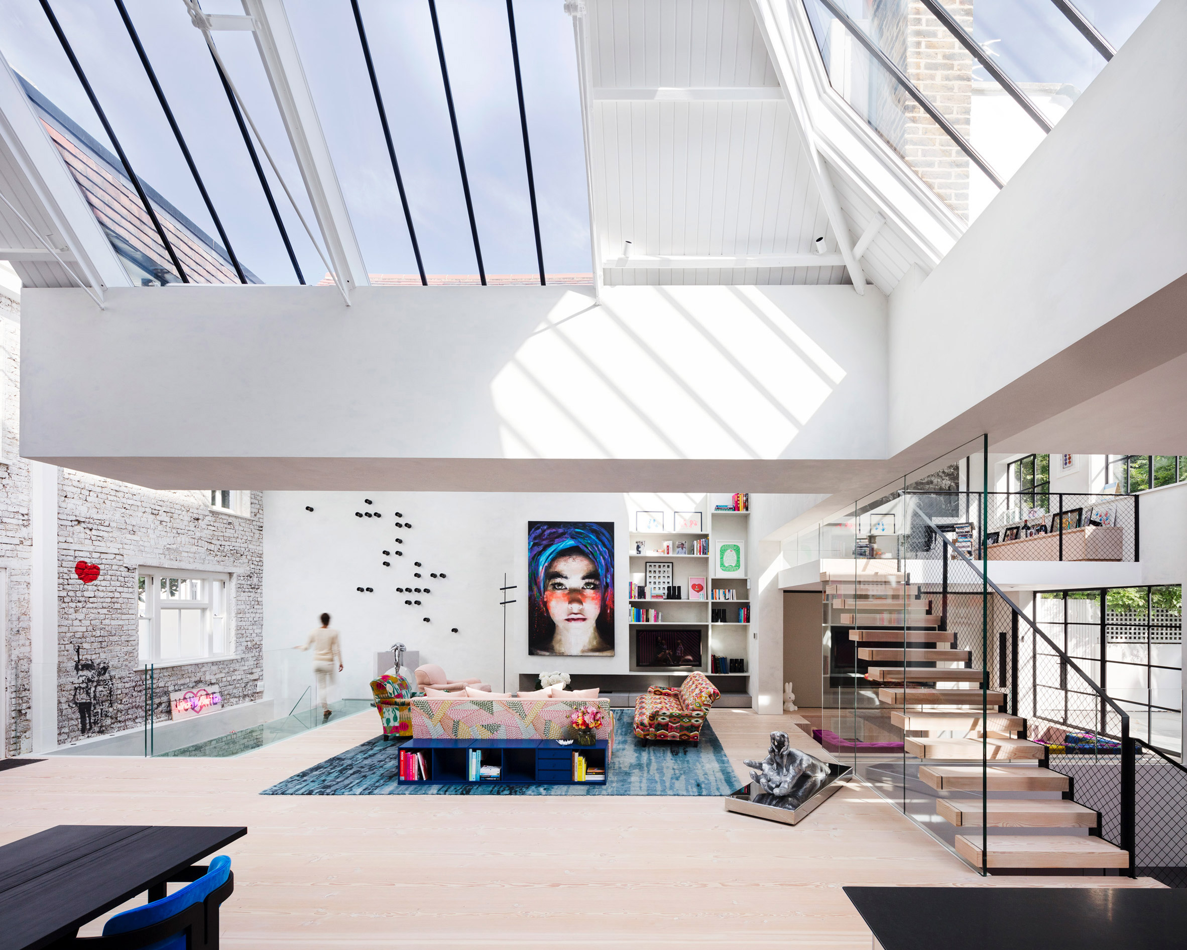 White loft space with skylights