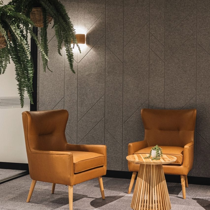 Two armchairs in front of Autex Acoustics panels