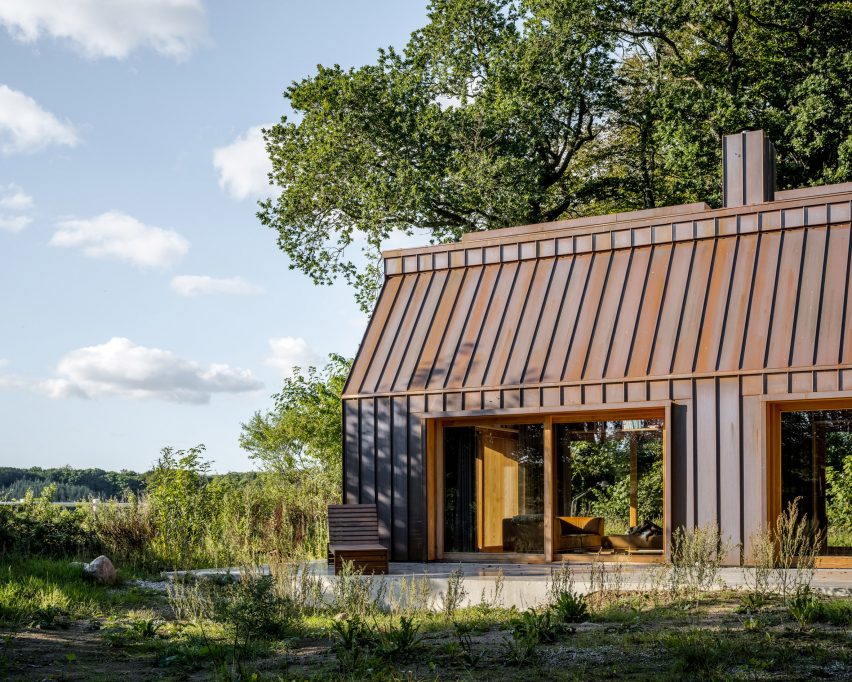 Copper cladding and wood-framed doors of The Author's House by Sleth