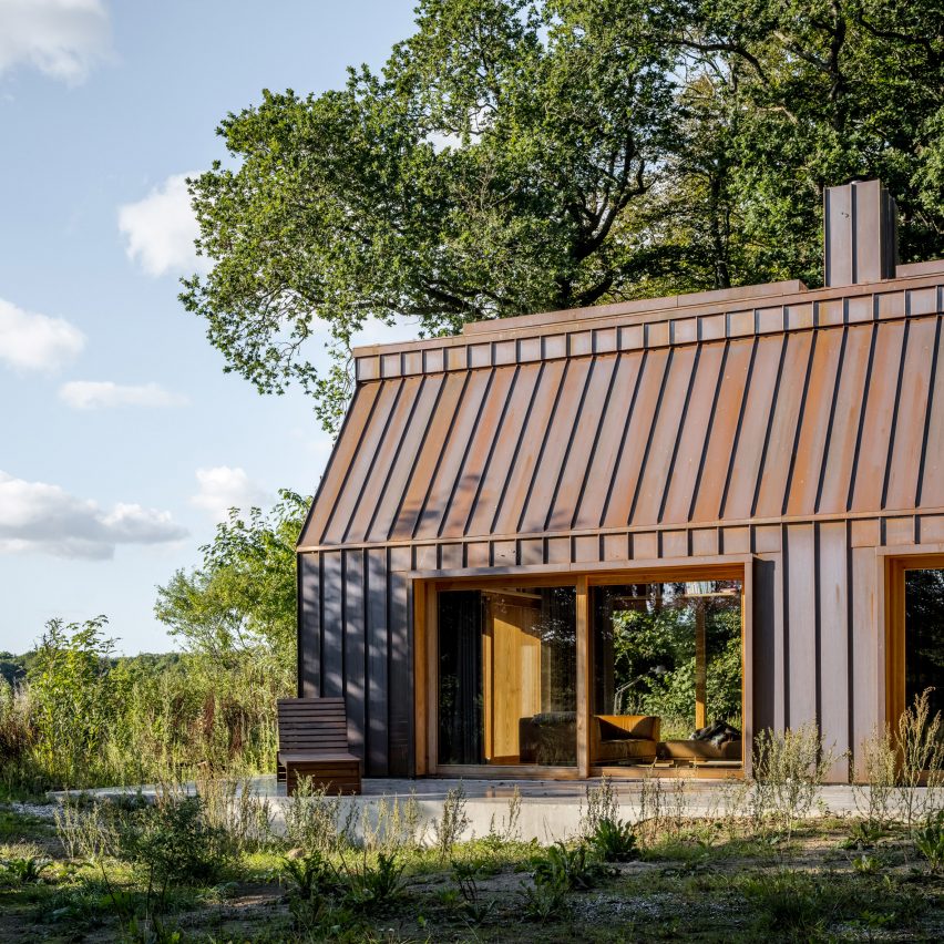 Copper cladding and wood-framed doors of The Author's House by Sleth