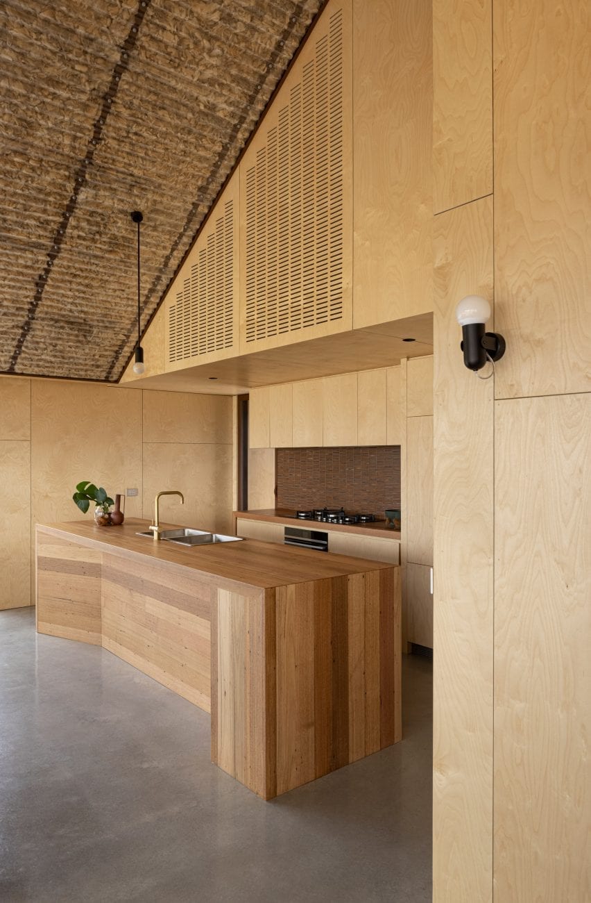 Plywood covers the walls of the kitchen at Coopworth house