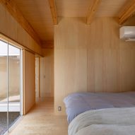 A wood-lined bedroom