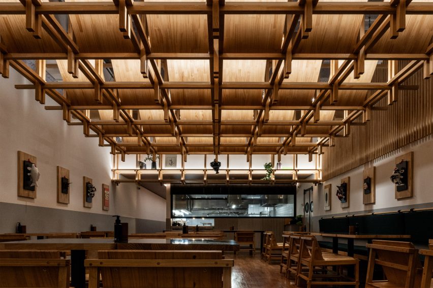 Restaurant interior design in São Paulo with wooden canopy