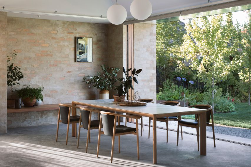 A dining room with brick walls 