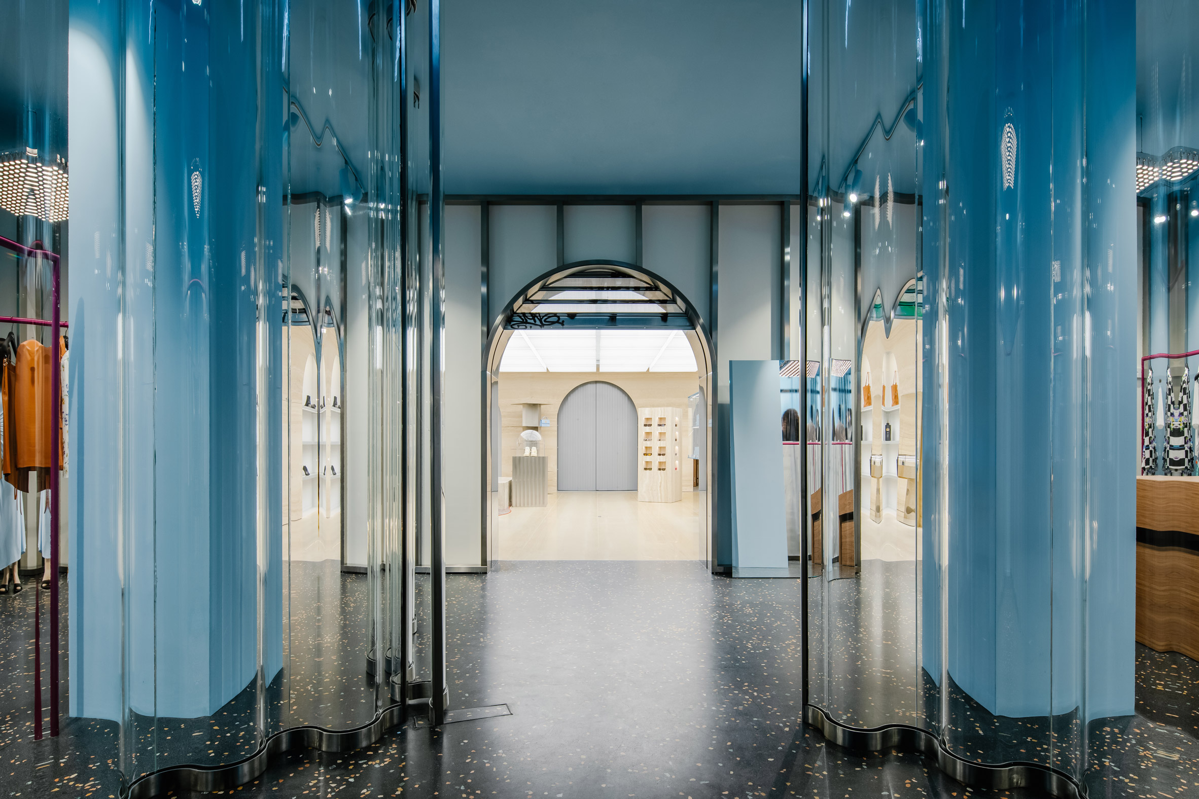 Blue pillars behind clear acrylic curtains in Off-White Paris store