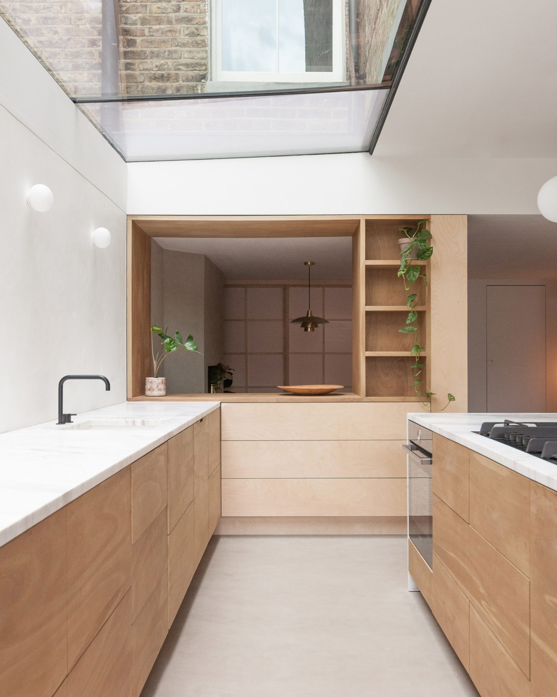 A kitchen with wooden cabinetry
