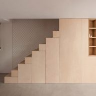 A wooden staircase with inbuilt storage