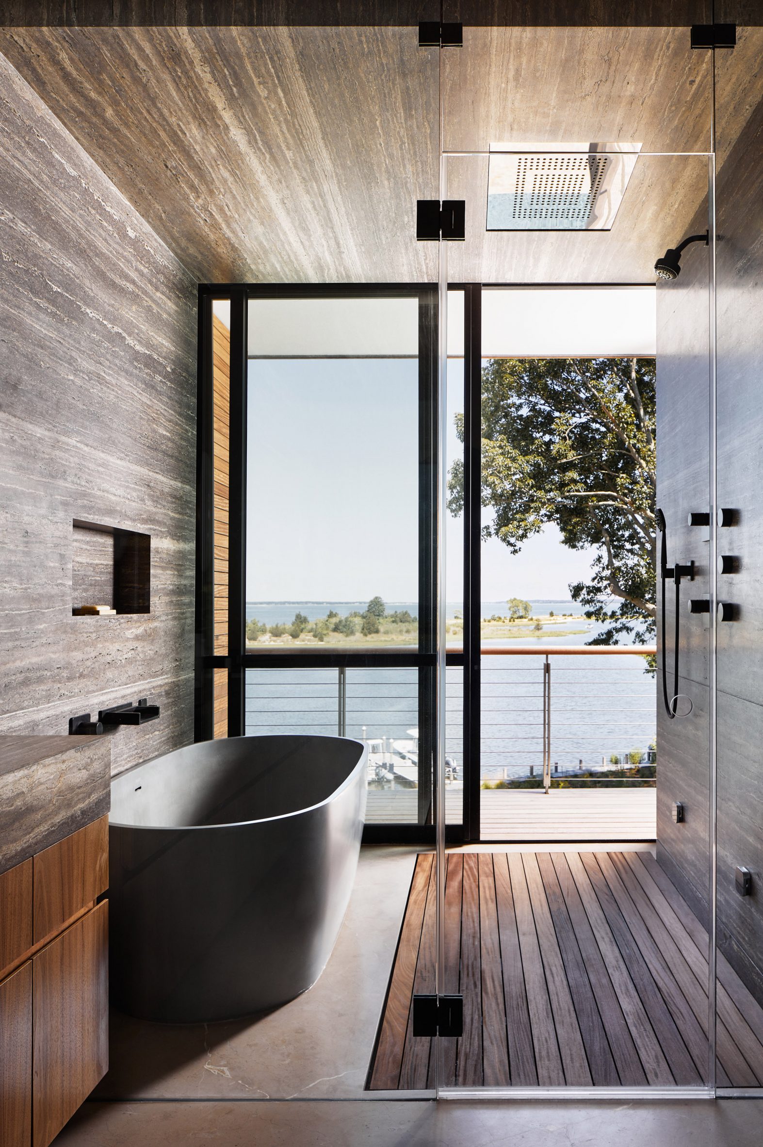 Bathroom with tub and shower that opens onto a balcony